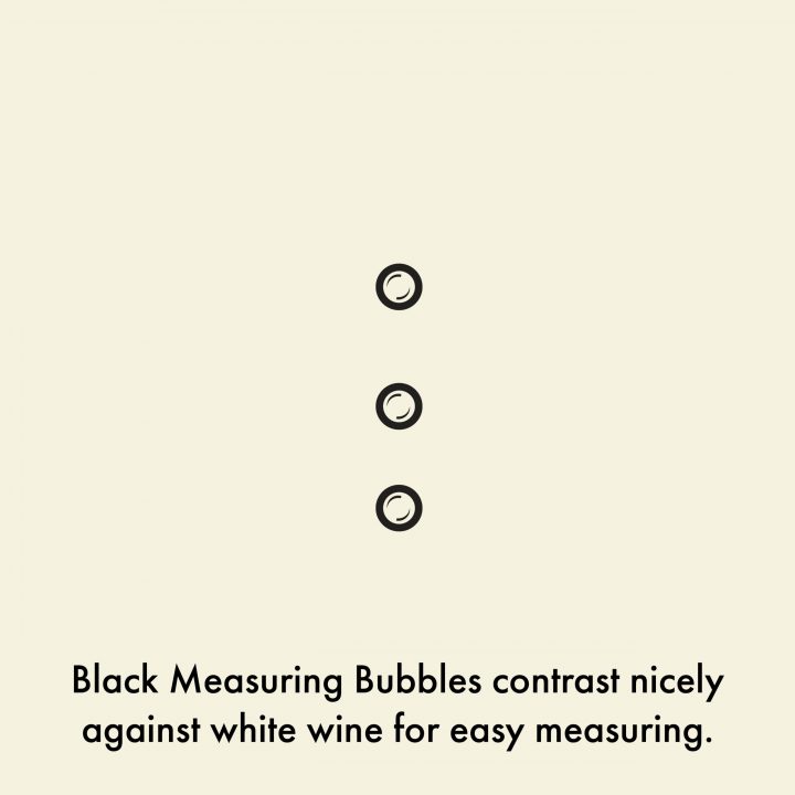 close-up of wine measuring marks of Medium Elegance Measuring Wine Glass. The black measuring bubbles contrast nicely against white wine for easy measuring.