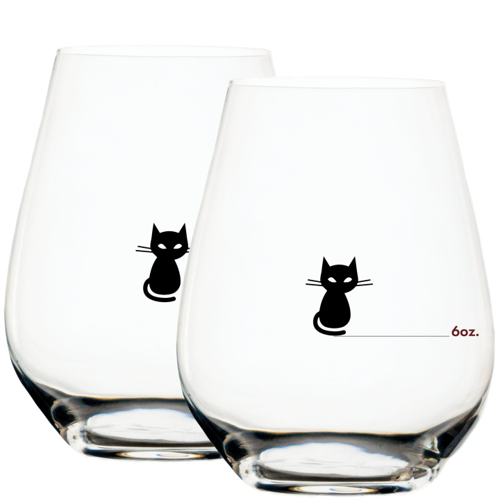closeup of black cat measuring wine glass with 6 ounce wine measuring mark